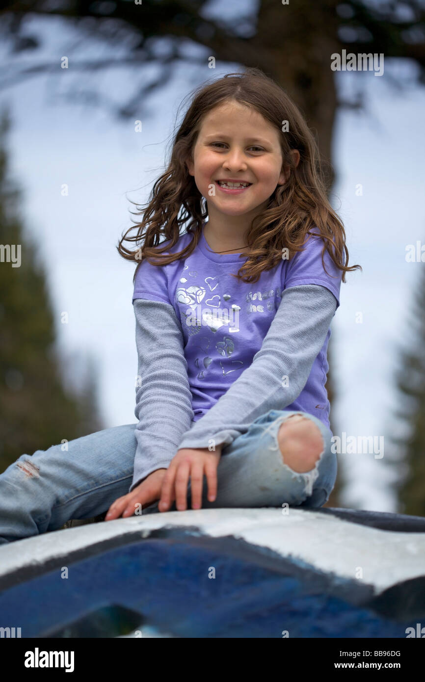 Portrait of a young girl playing at the playground Stock Photo - Alamy