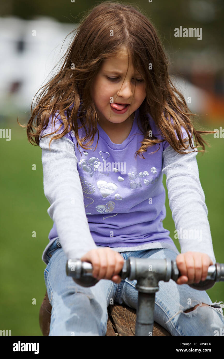 Portrait of a young girl playing at the playground Stock Photo