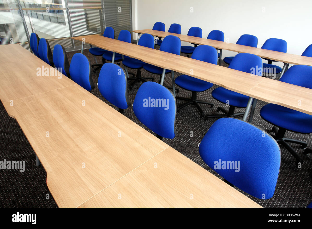 New desks and blue chairs Stock Photo Alamy