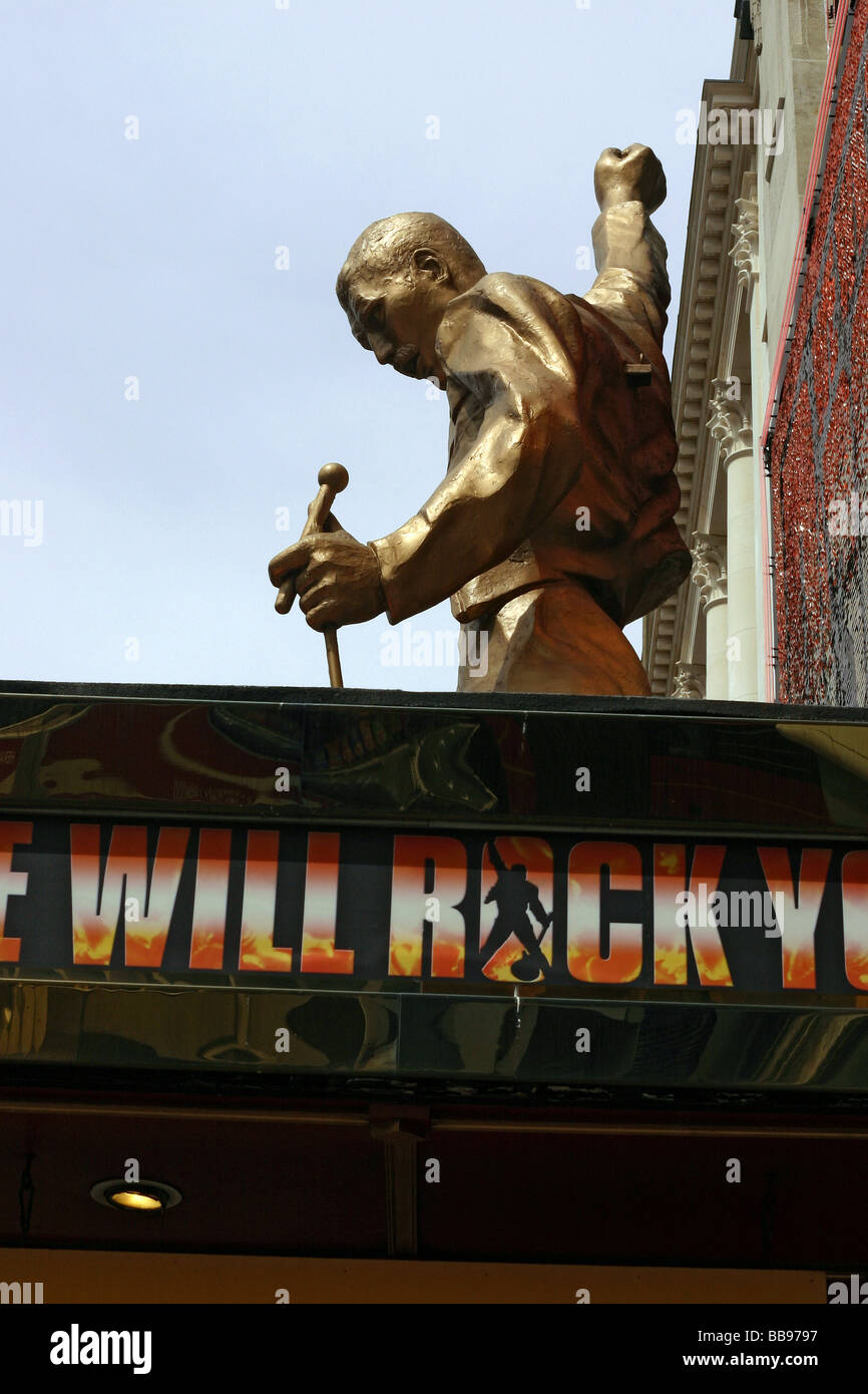 Golden Freddie Mercury figure above theatre entrance West End London UK Stock Photo