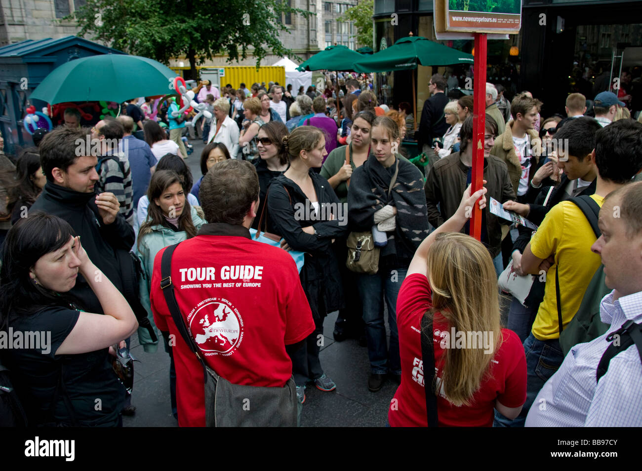 Tour Guide, Edinburgh, gathering customers before setting off on historic tour of city, Scotland