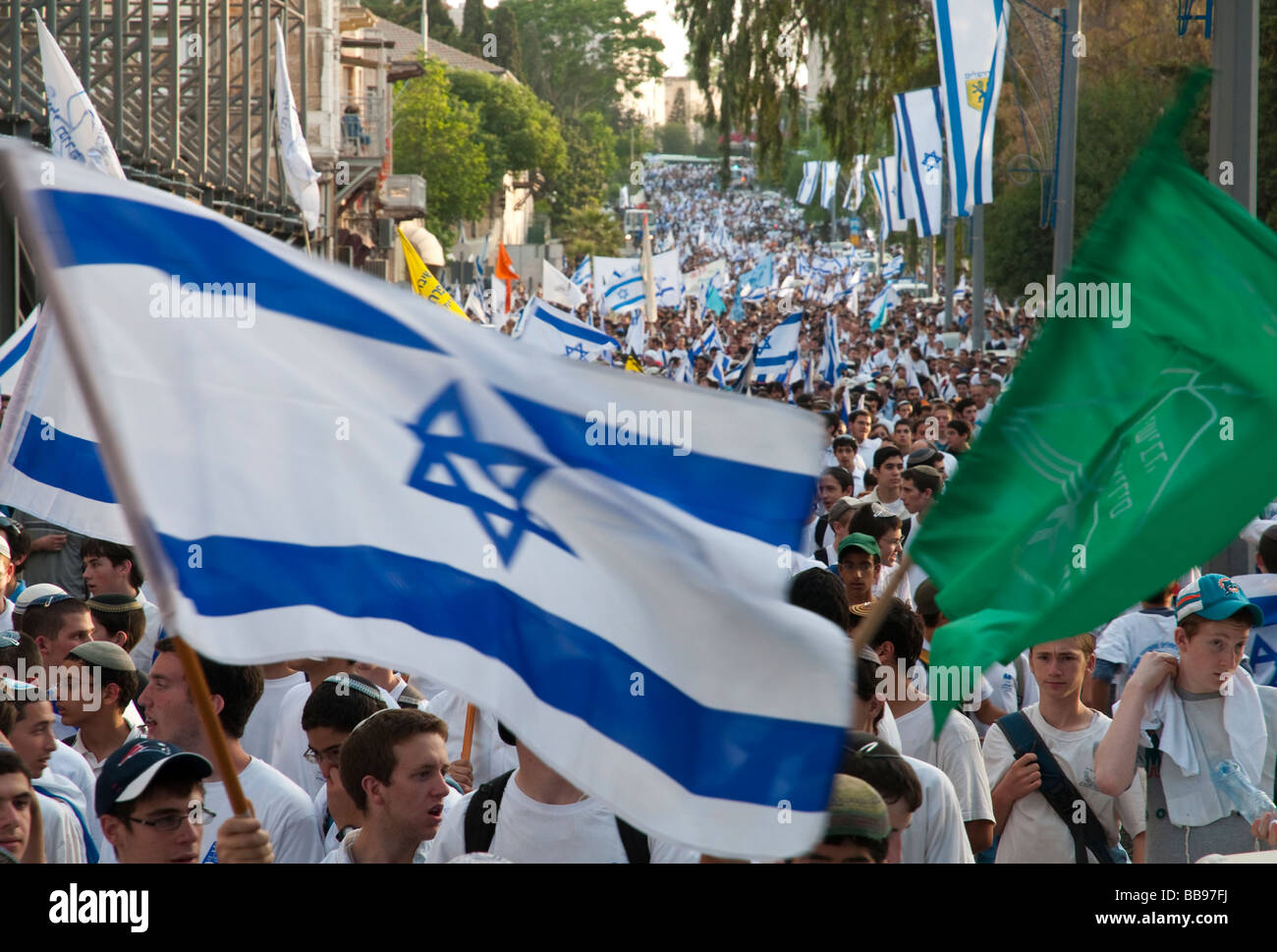 Israel Jerusalem Jerusalem day celebration crowd marching with israeli flags in Agron street Stock Photo