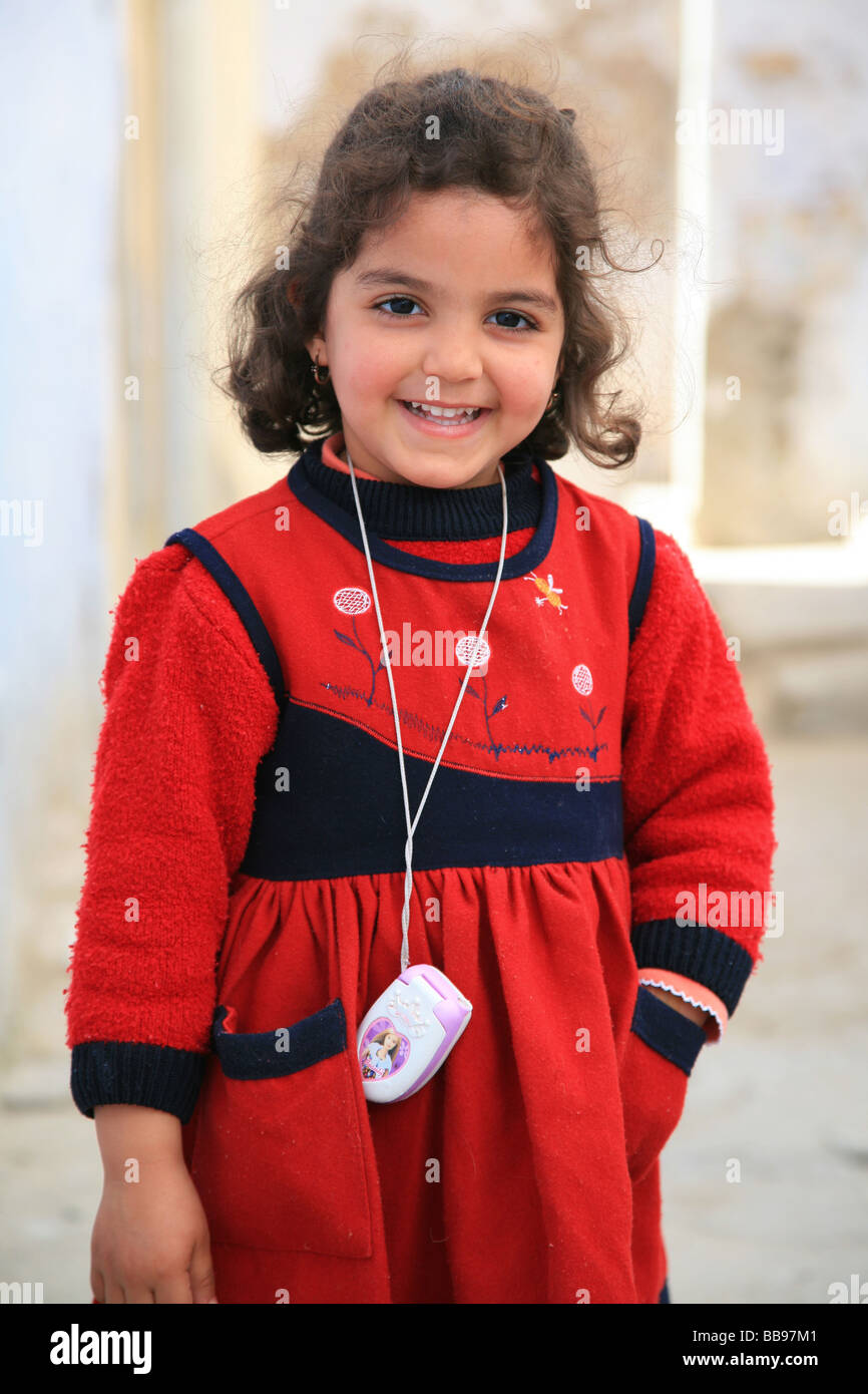 Young smiling Tunisian girl in Kairouan, Tunisia Stock Photo