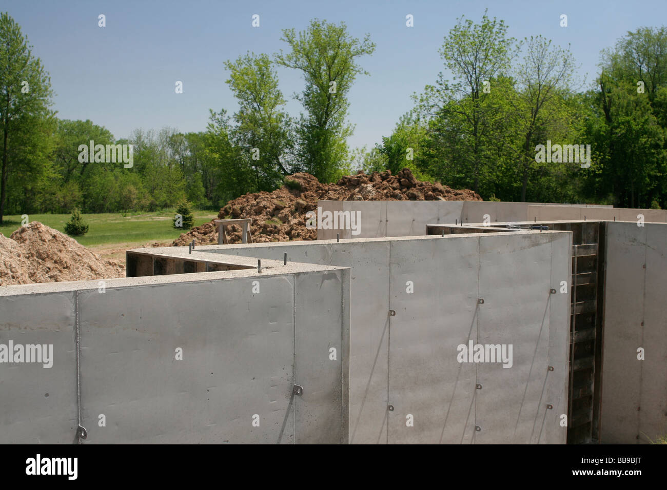 Poured concrete basement walls on new home under construction Stock Photo