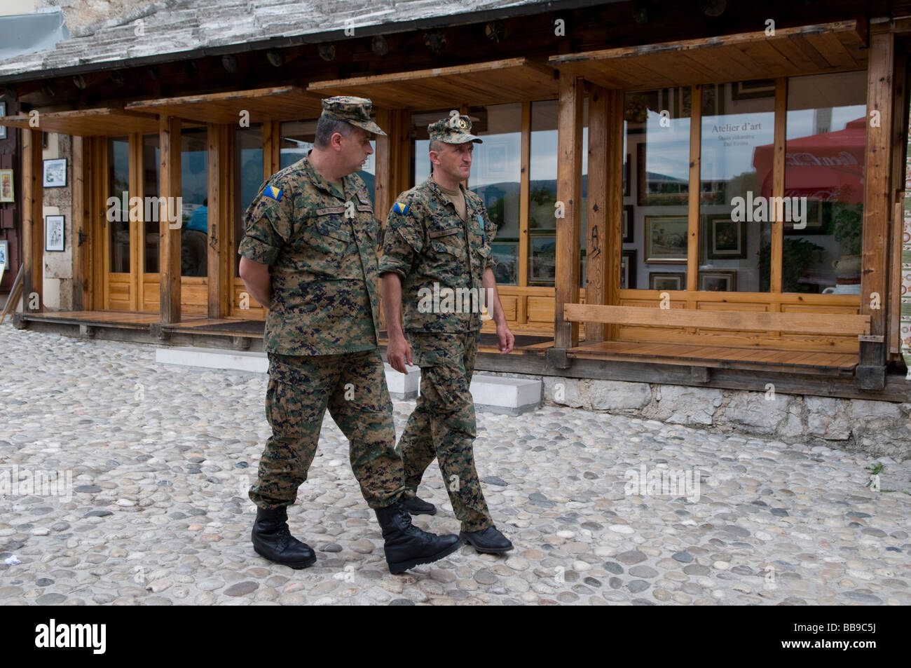 Bosnian soldiers walk in the city of  Mostar in Bosnia Herzegovina Stock Photo