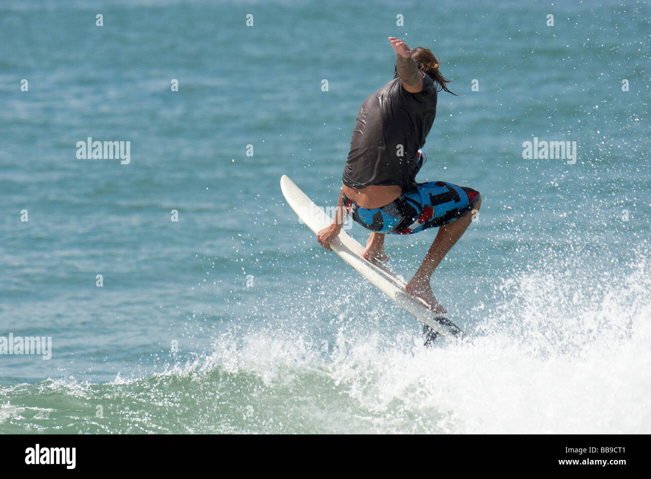 Surfing at Estaleiro Beach Stock Photo