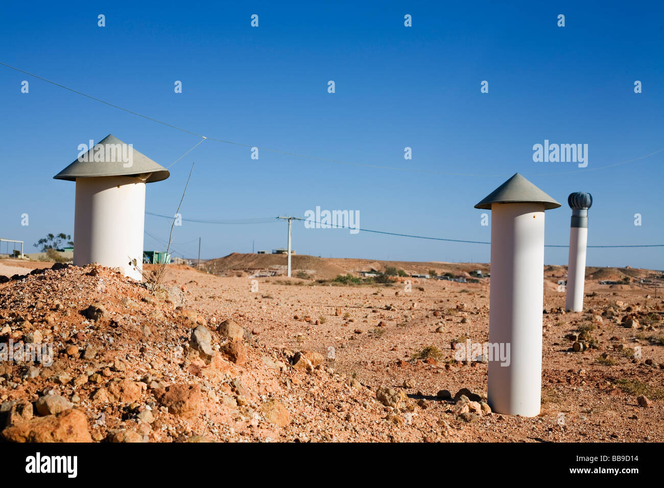 Air vents on the surface provide ventilation for underground homes, known as dugouts.  Coober Pedy, South Australia, AUSTRALIA Stock Photo