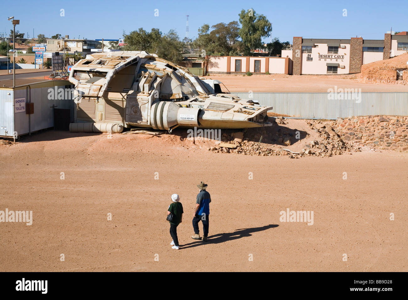Tourists inspect a spaceship - a movie prop - in the main street of Coober Pedy, South Australia, AUSTRALIA Stock Photo