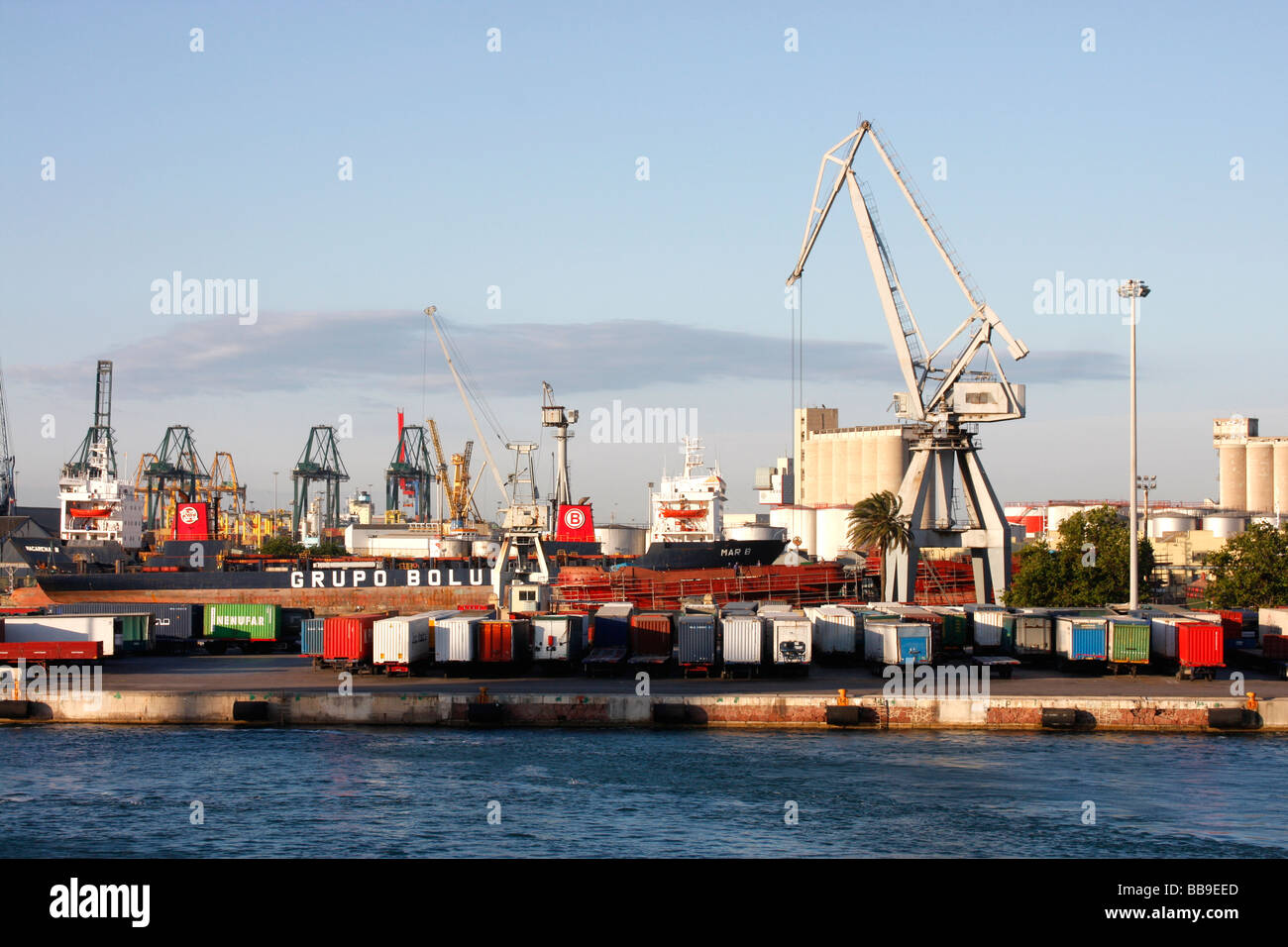 Ships and loading docks at the second largest Spanish seaport of Valencia. Stock Photo