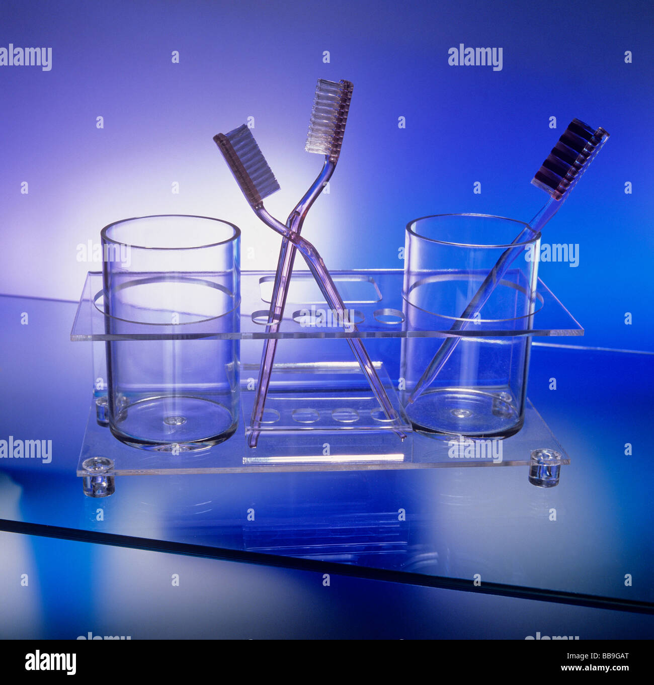 plastic toothbrushes in plastic cups and holders from the seventies