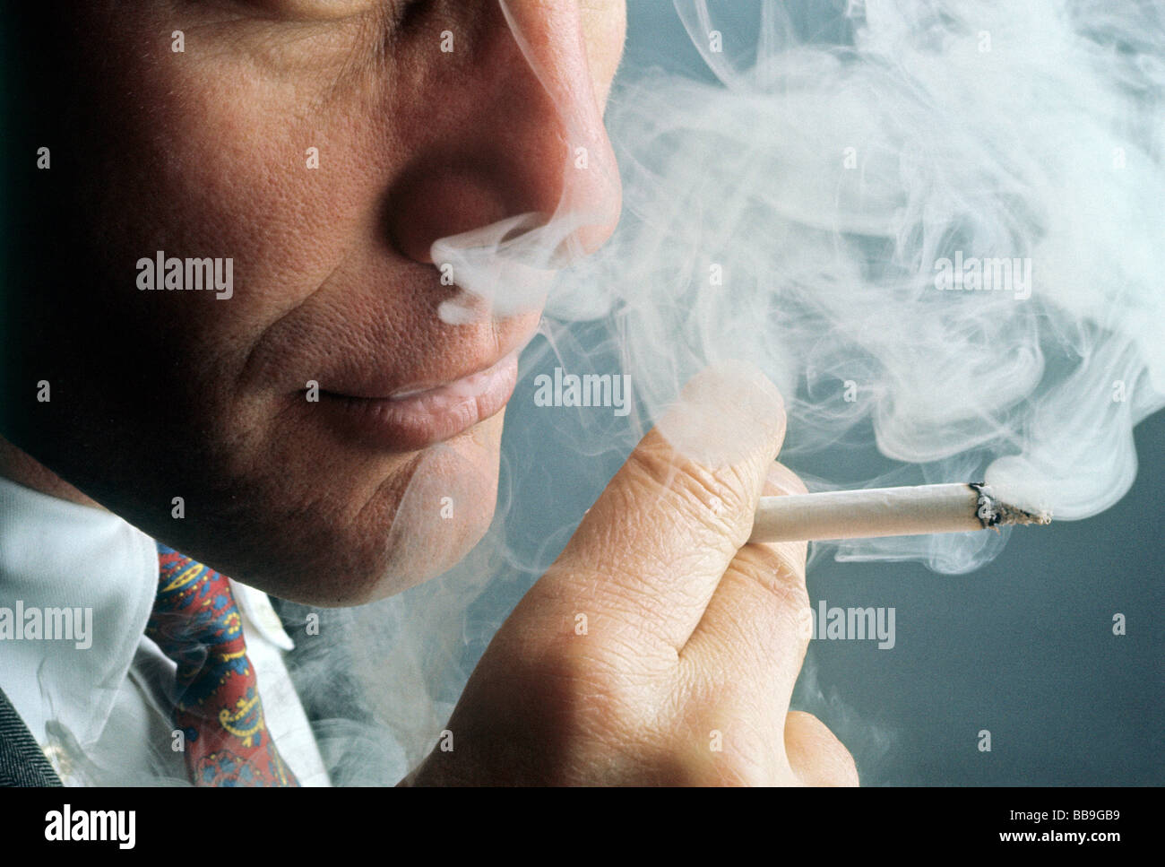 portrait of man smoking cigarette Stock Photo