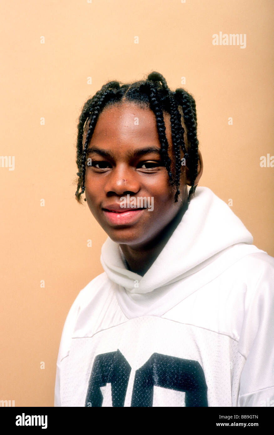 Black teen male portrait with hair done in a plat style Stock