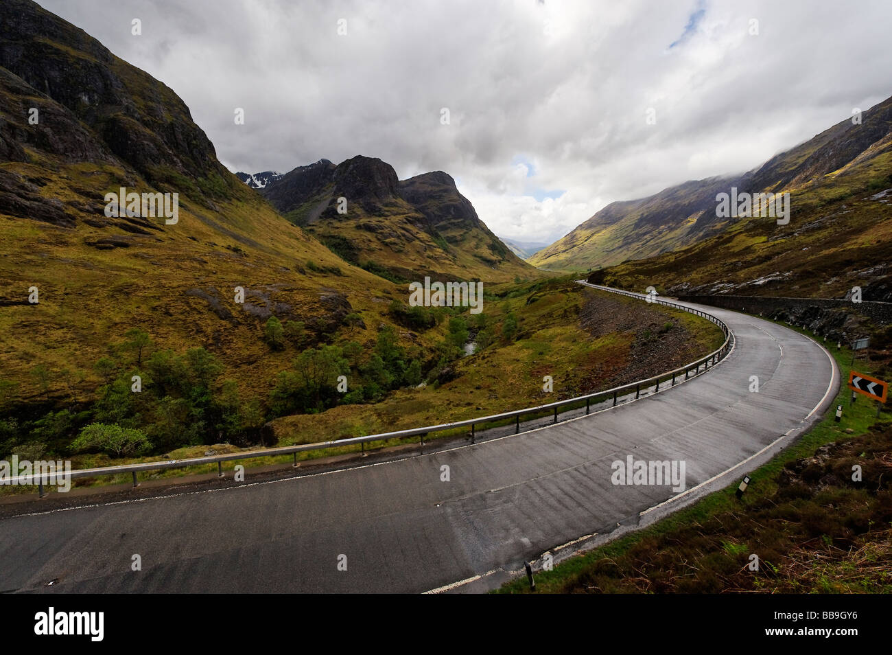 A dramatic curve on the A82 as it sweeps through Glen Coe in the Scottish Highlands. Stock Photo