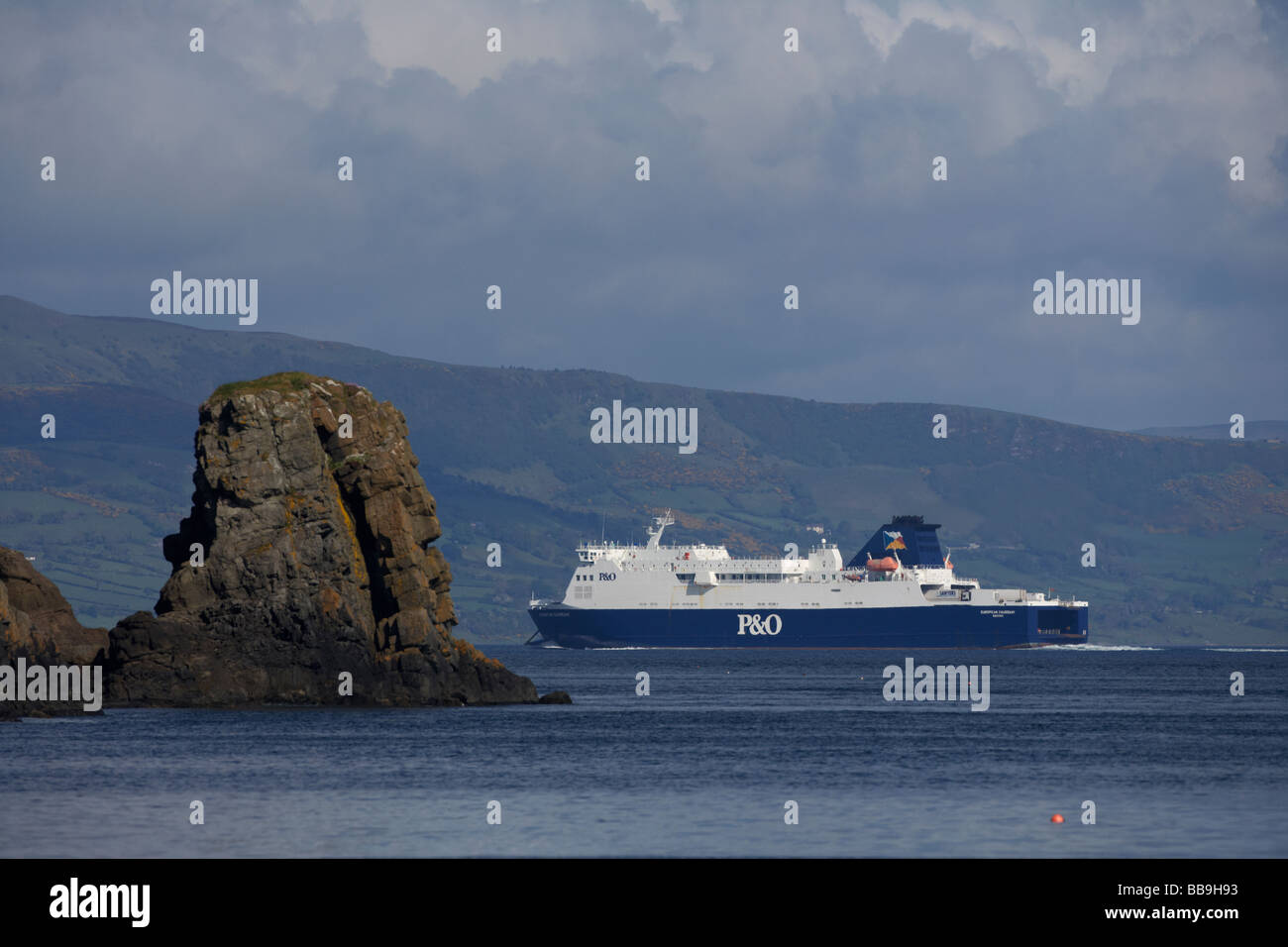 P O passenger ferry on the larne cairnryan route the european causeway approaches larne past rocks at islandmagee Stock Photo