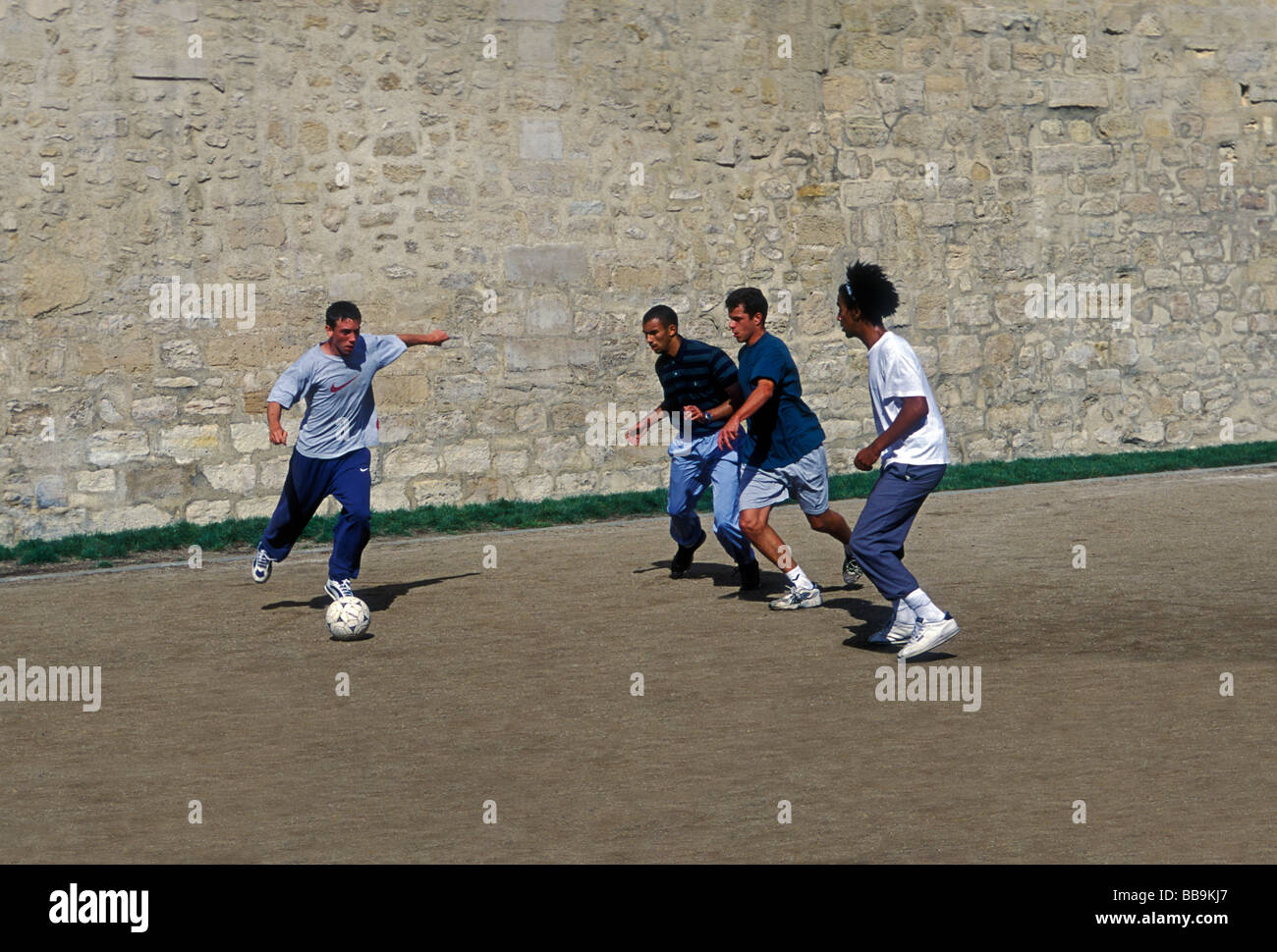 French students, gym class, soccer player, soccer players, playing soccer, soccer game, Lycee Charlemagne, Marais District, Paris, France, Europe Stock Photo