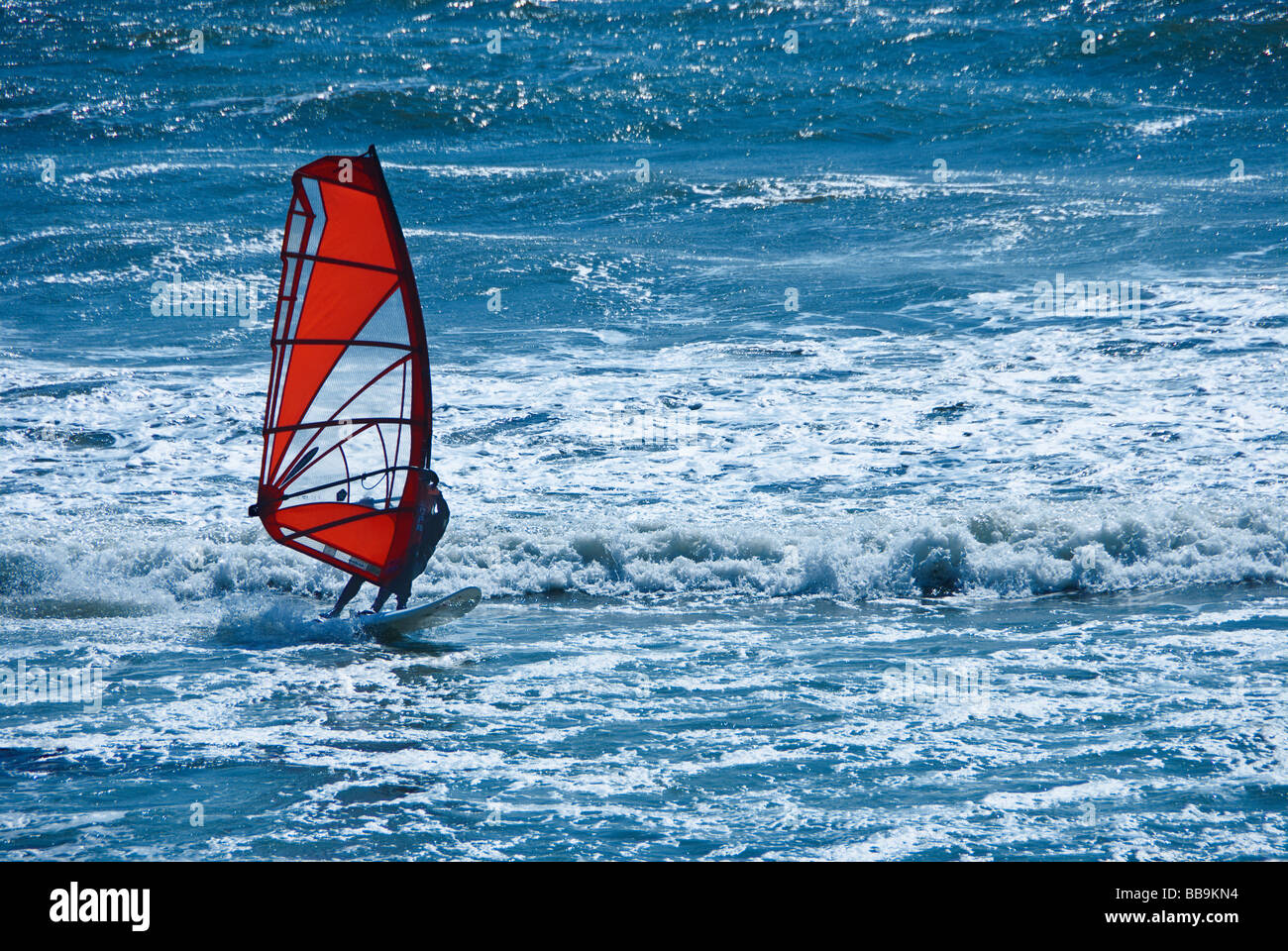 Wind surfer surfing off the Northern California coast at Waddell Beach USA Stock Photo