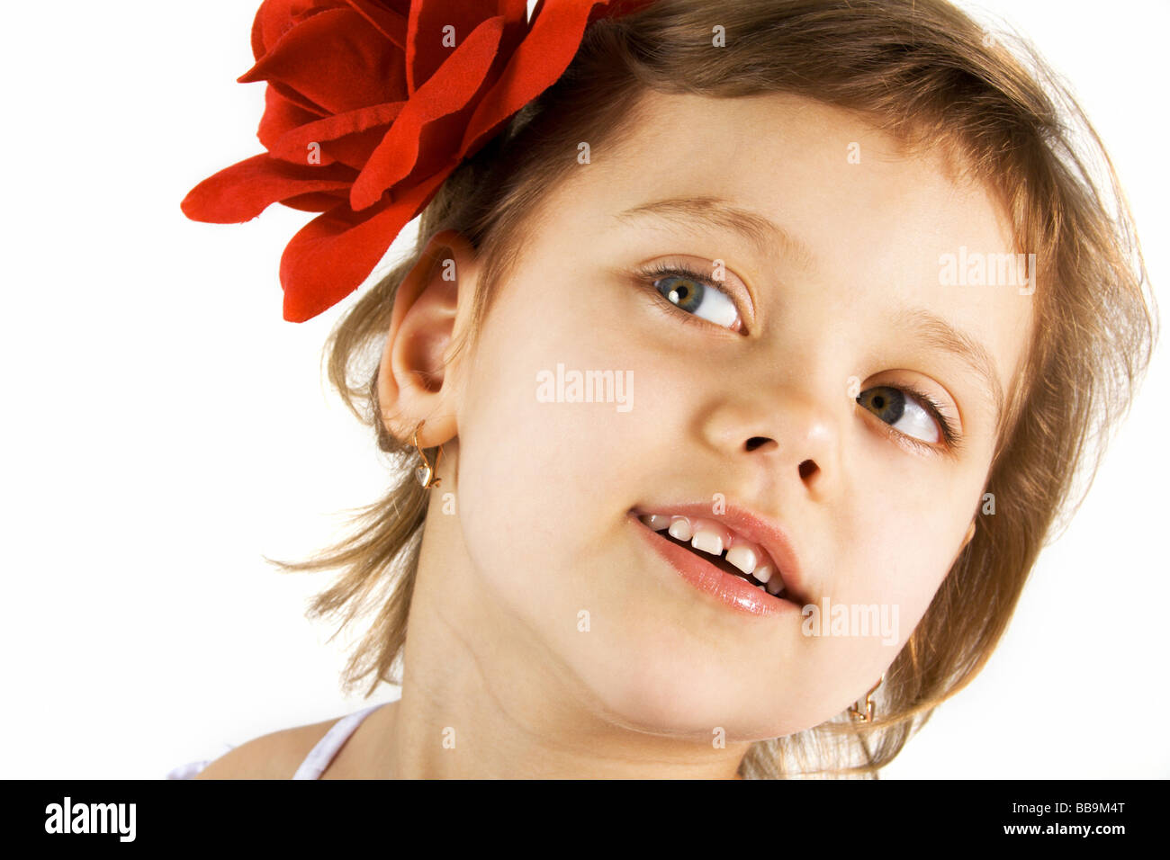 Little girl with red rouses in the hair Stock Photo - Alamy