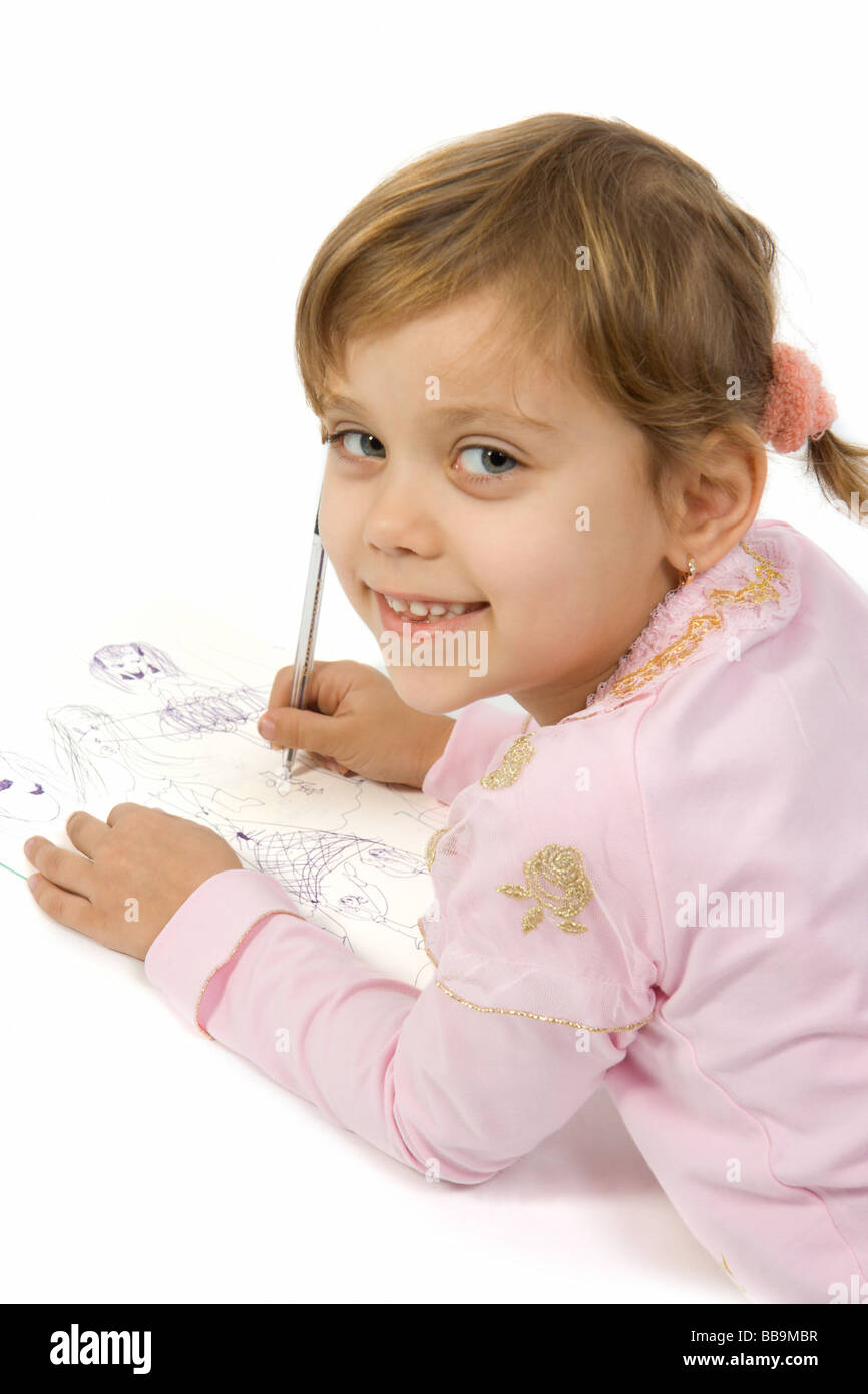 Little pretty smiling girl painting Stock Photo - Alamy