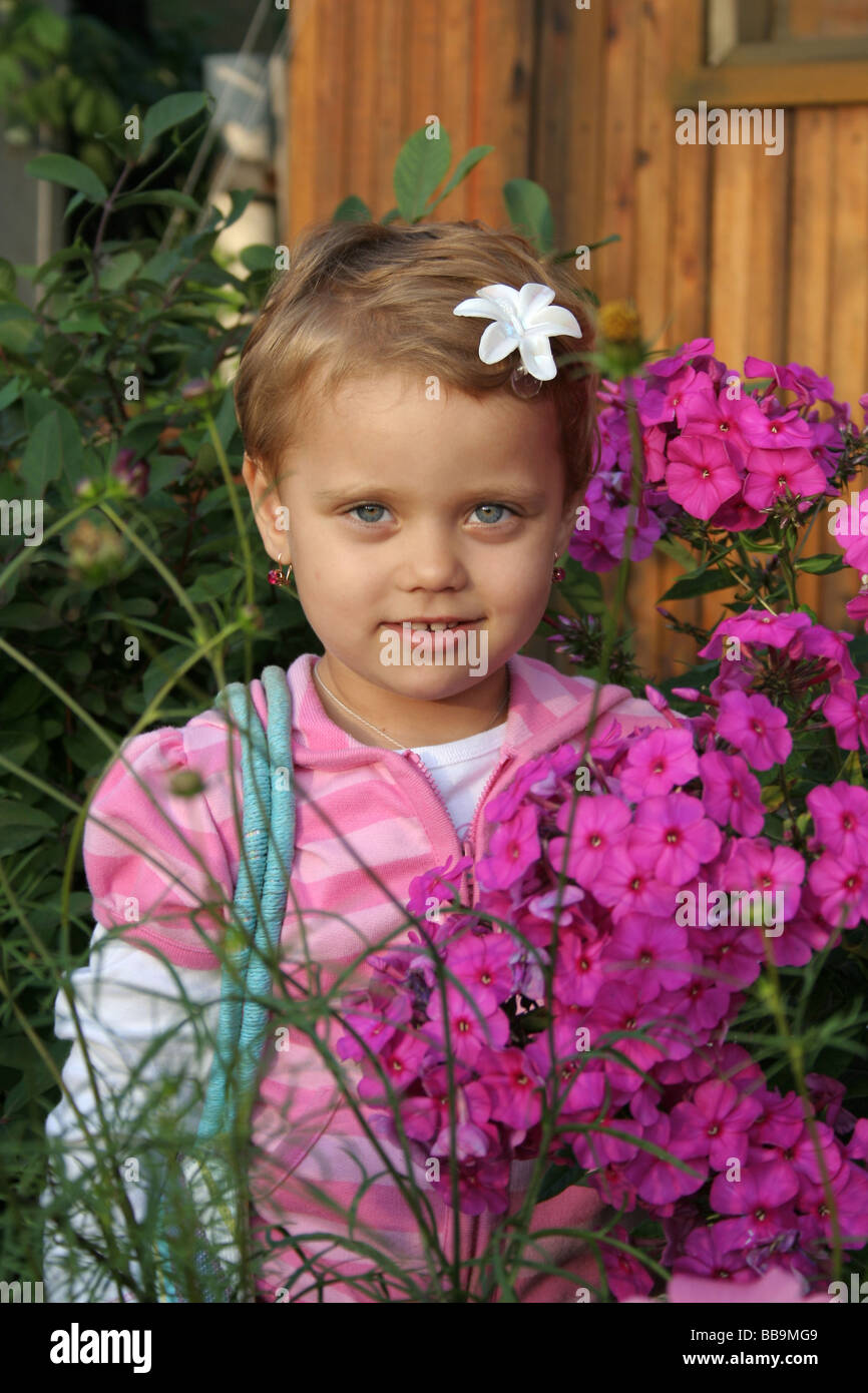 Little girl with flower Stock Photo Alamy