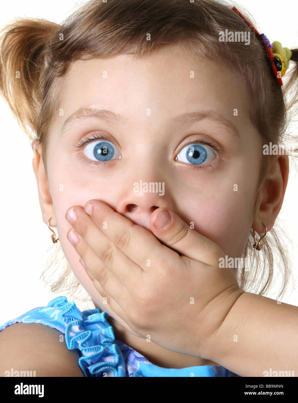 Surprised little girl isolate on white Stock Photo - Alamy