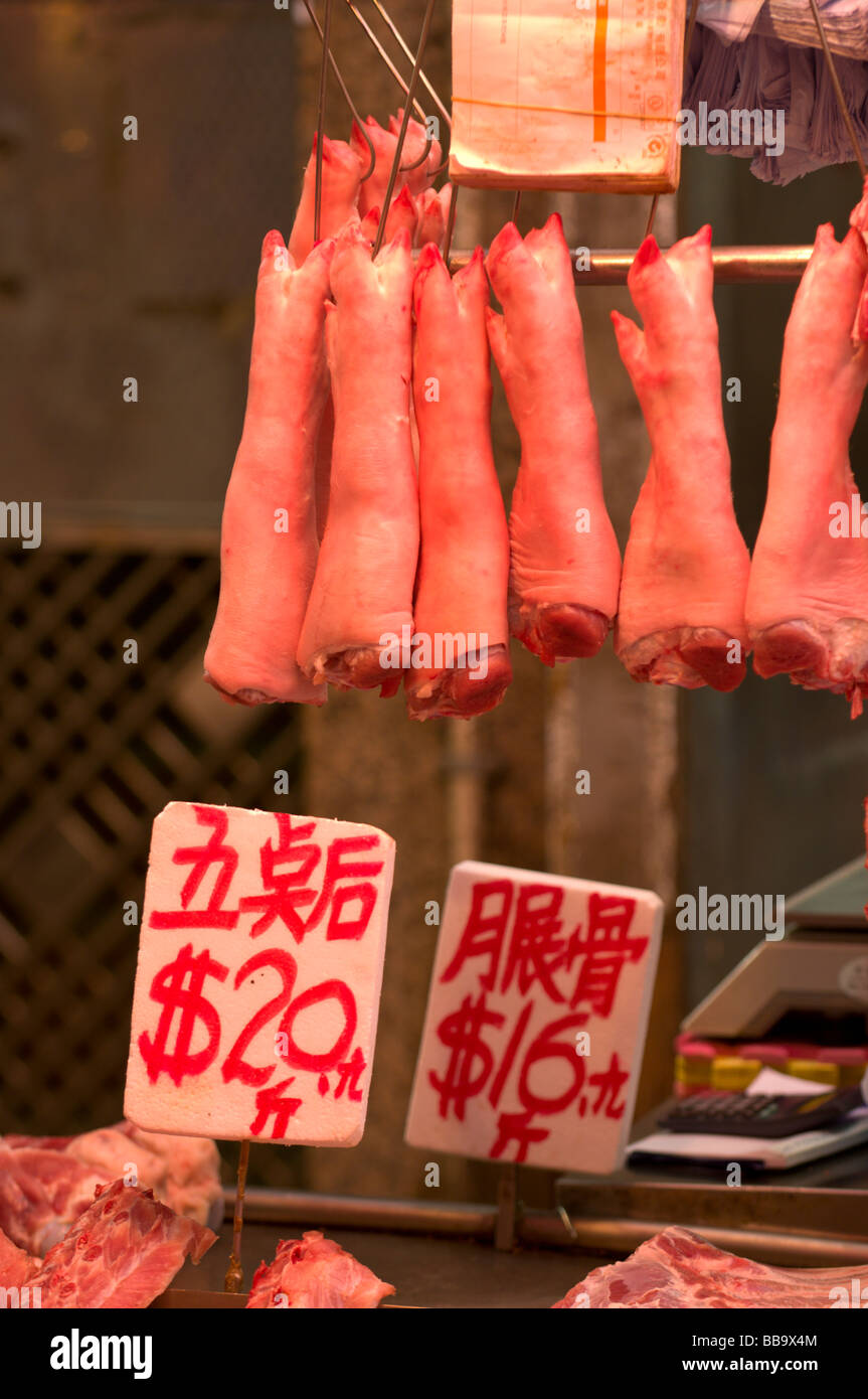 Pigs trotters for sale at a local butcher Stock Photo