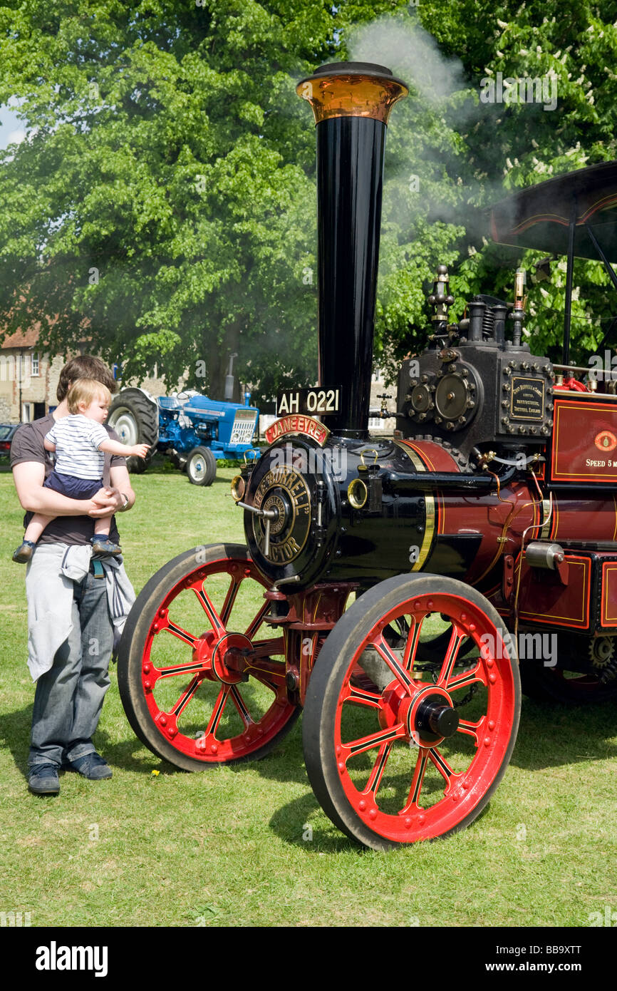 A Toddler looking at a traction engine, Wallingford Classic Car Rally, Oxfordshire, UK Stock Photo