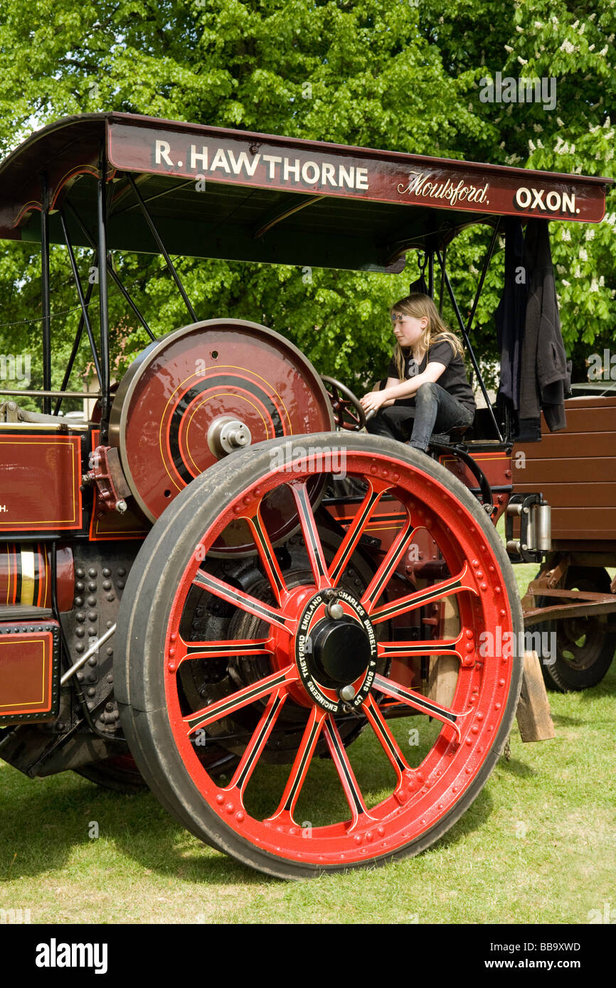 A young girl in control of a traction engine, Wallingford  Oxfordshire, UK Stock Photo