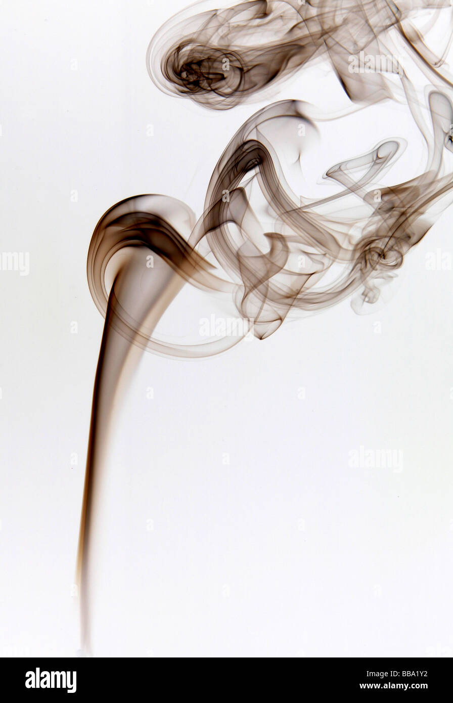Smoke patterns. Smoke forming vortices (swirling patterns) in the air Stock Photo