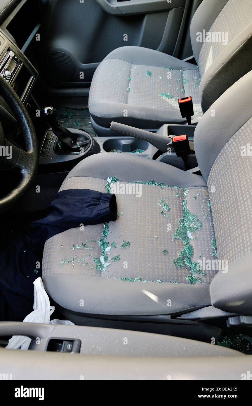 Front seats of a car which has had a window broken to steel contents Stock Photo