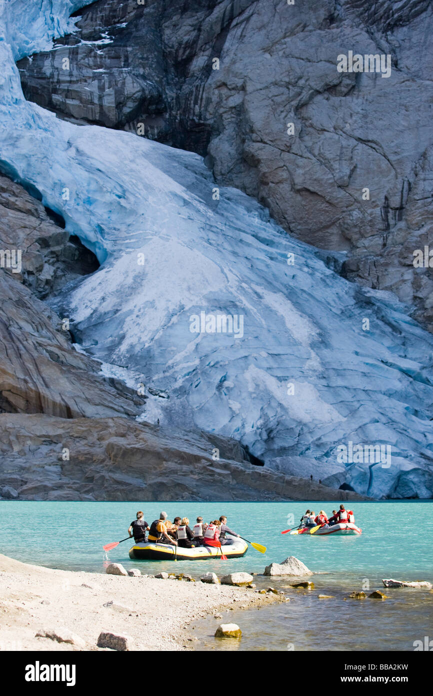 Rubber boat tour on the glacial lake in front of the Briksdalsbreen glacier, Norway, Scandinavia, Europe Stock Photo