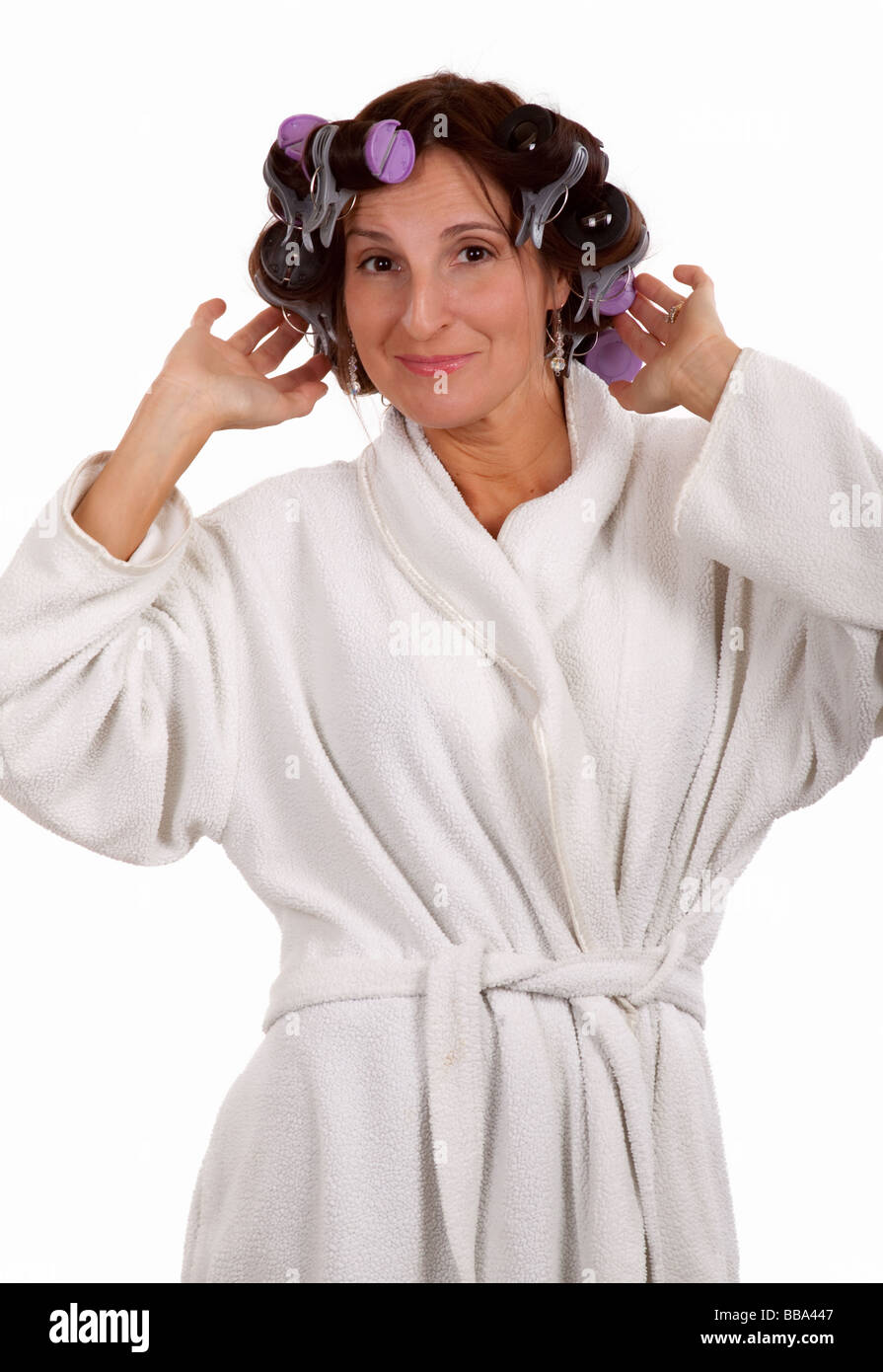 Woman in robe and curlers Stock Photo - Alamy
