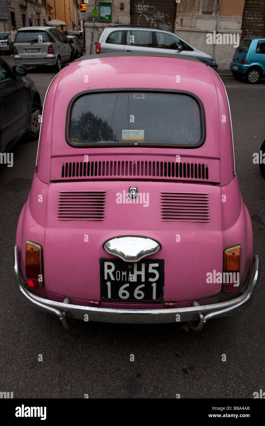 Italian pink Fiat 500 Cinquecento in Trastevere Rome Italy Stock Photo