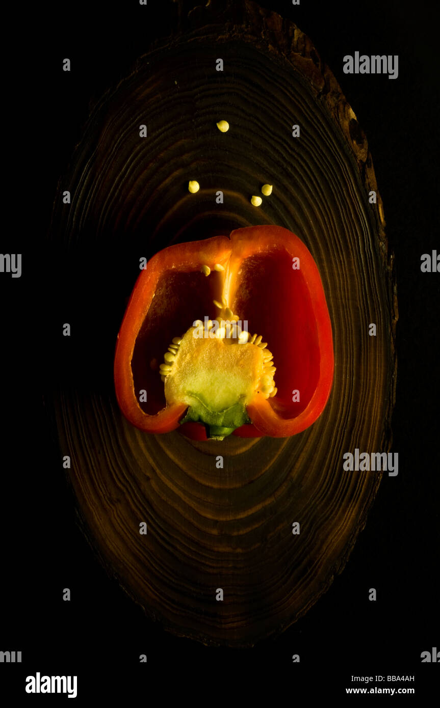 Sliced red bell pepper placed on a dark wooden plank Stock Photo - Alamy