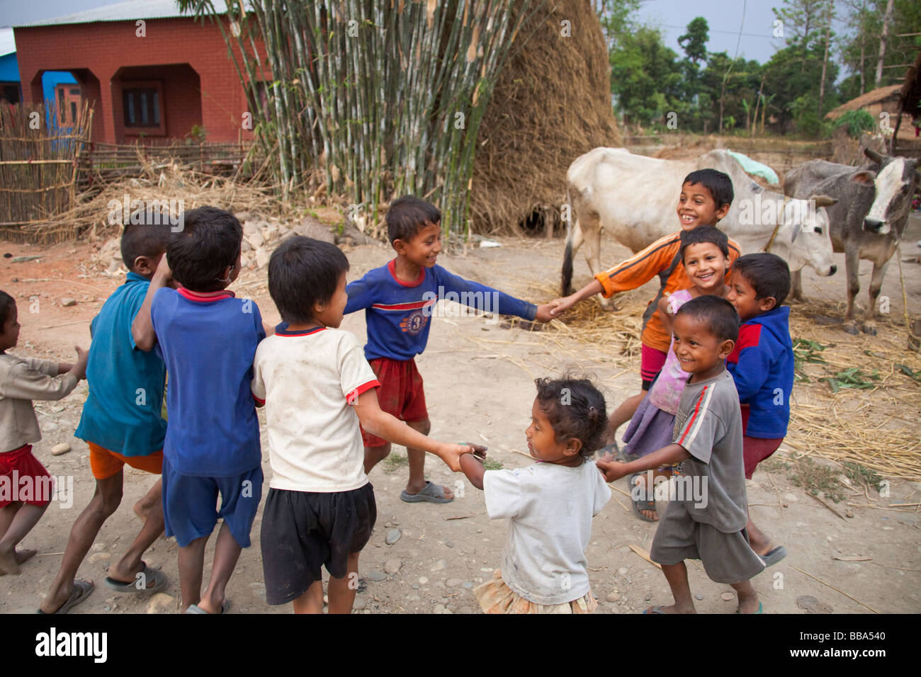 Young Children playing in street in remote village Chitwan National