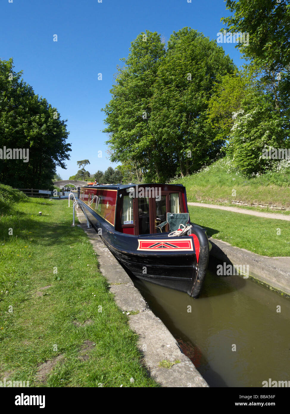 A narrow boat entering a lock on the Shropshire Union Canal near Audlem, Shropshire, England. Stock Photo