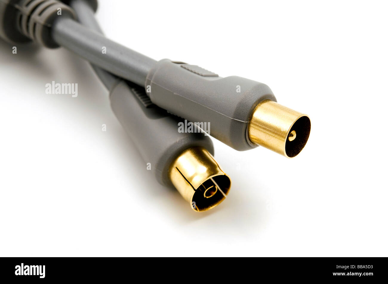 Gold plated cables on a white background Stock Photo