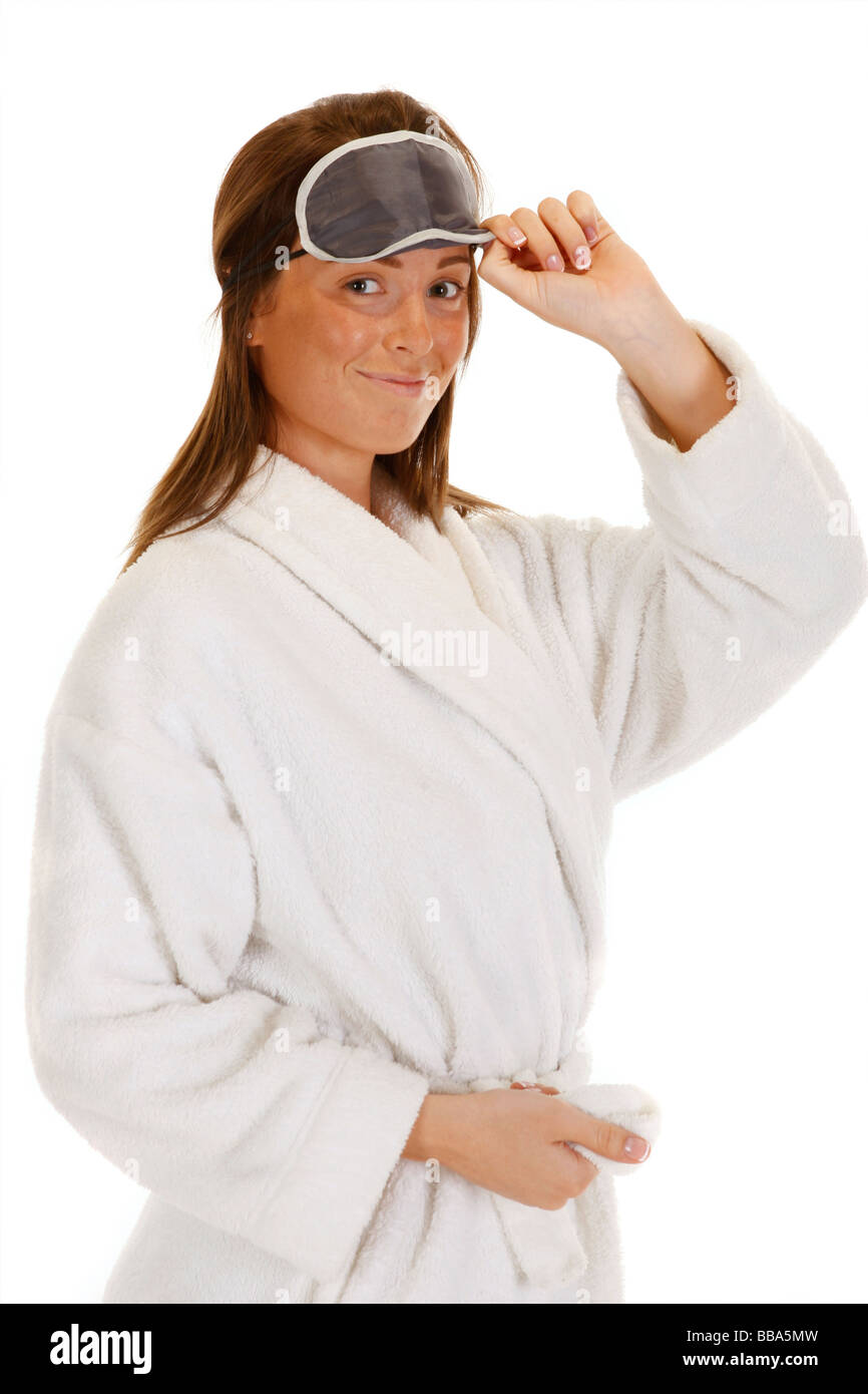 Young female adult with eye mask for to keep out light for a good nights sleep Stock Photo