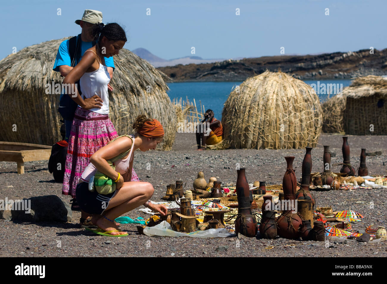 Tourists buying crafts at the El Molo village on the shore of Lake Turkana, Kenya Stock Photo