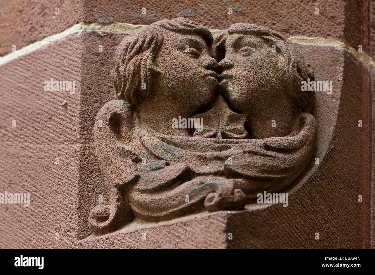 Medieval sandstone relief of a kissing couple, Freiburg, Baden-Wuerttemberg, Germany, Europe Stock Photo