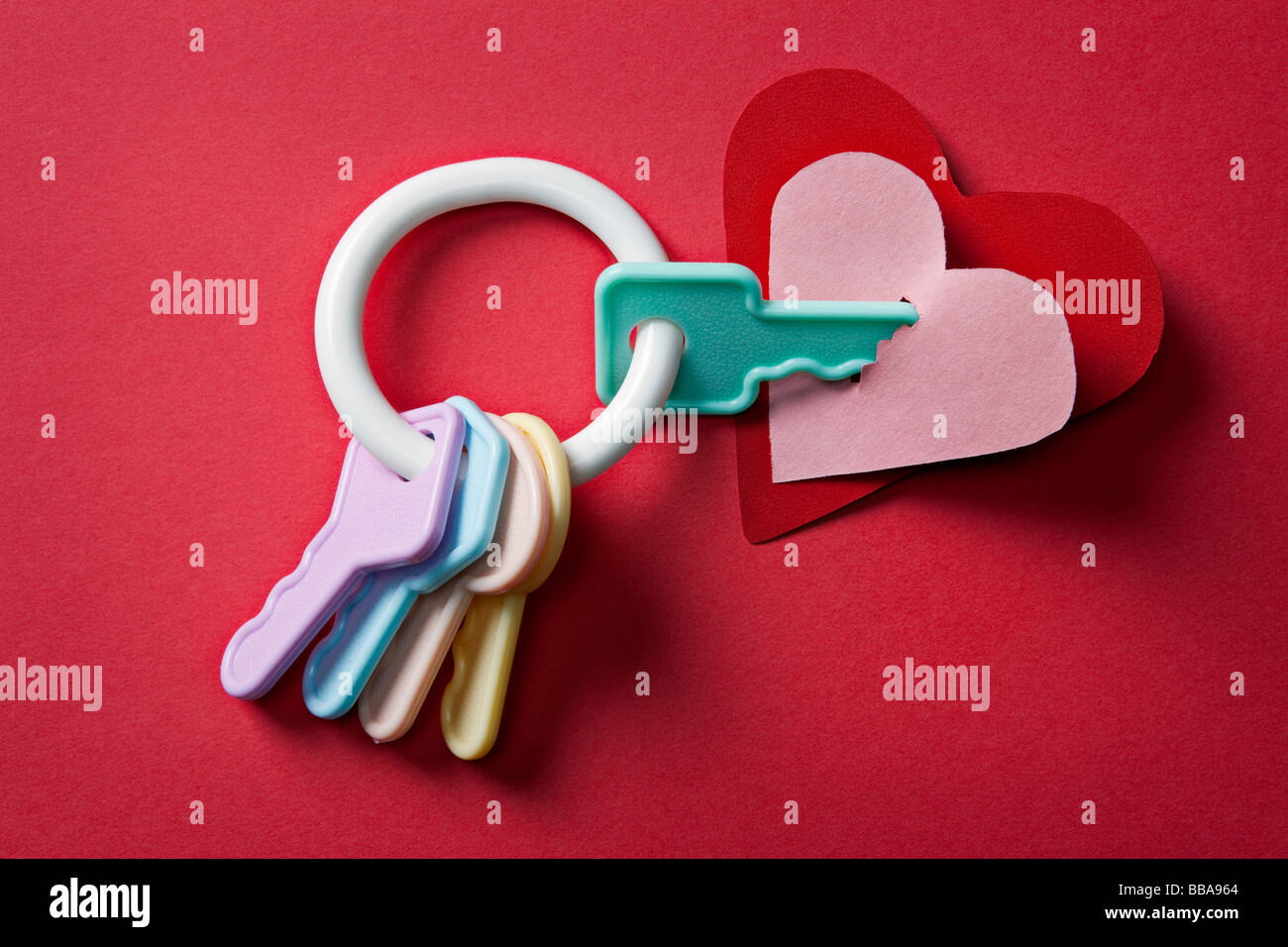 child's plastic keys and pink and red heart Stock Photo Alamy