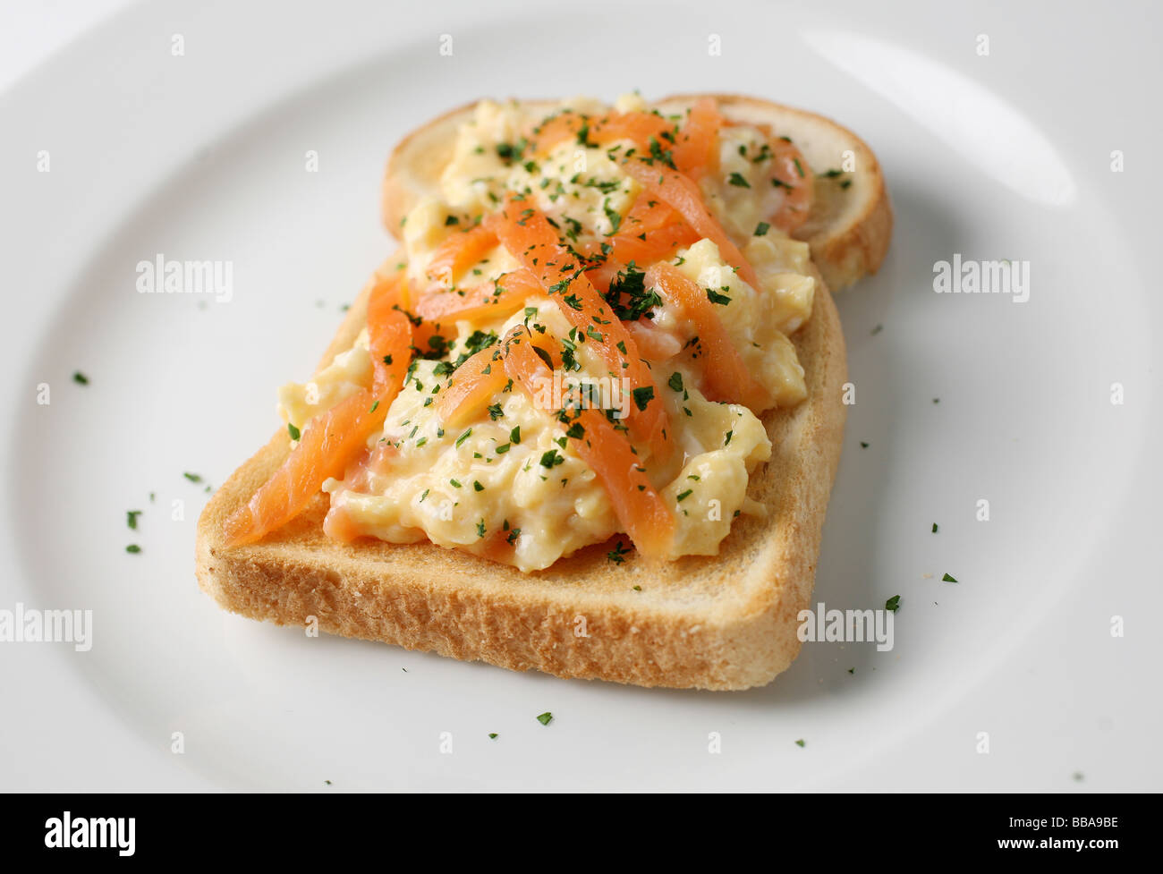 Smoked Salmon and scrambled egg on toast Stock Photo