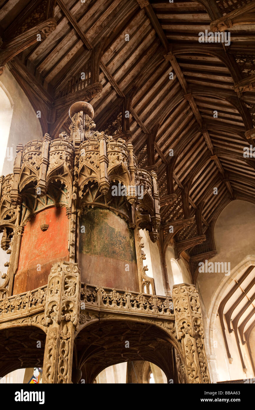 UK England Norfolk Trunch village St Botolphs parish church medieval carved wooden font cover and roof Stock Photo