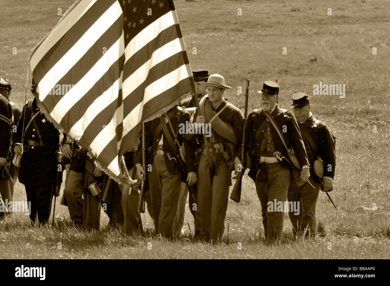 Union Soldiers carrying the flag in a civil war re-creation Stock Photo