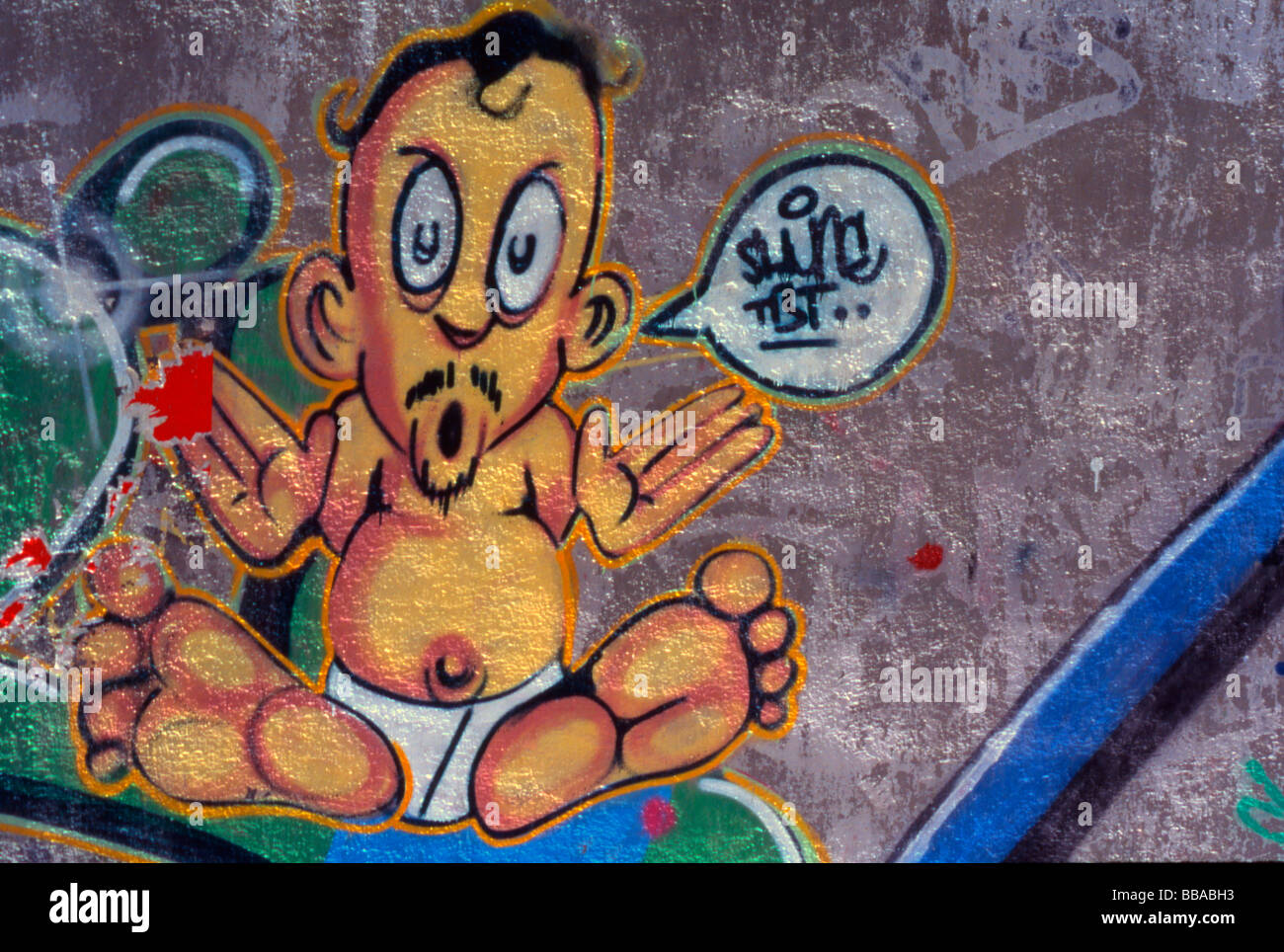Madrid, Spain. Graffiti baby with moustache and beard Stock Photo
