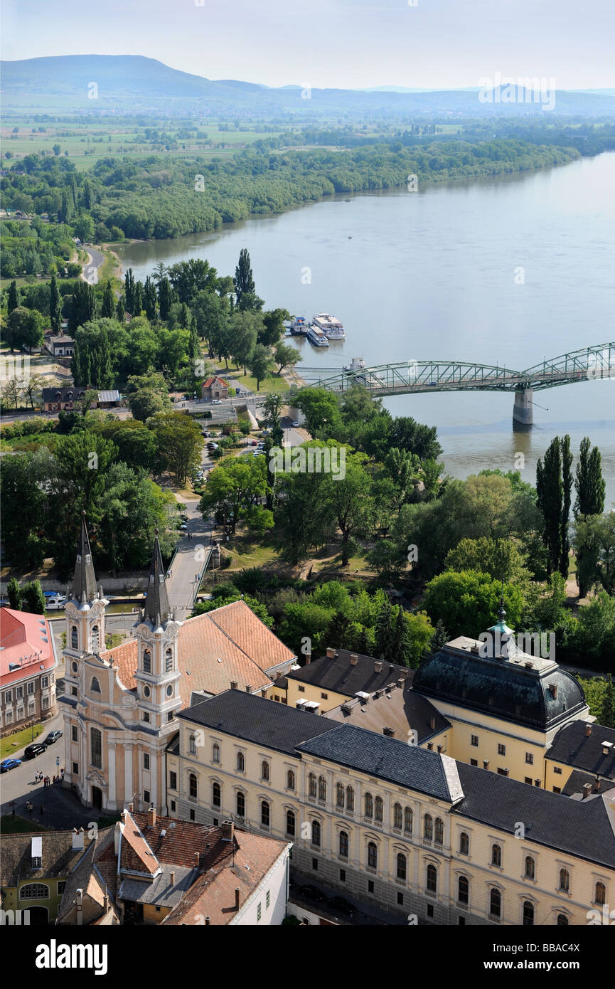 The Maria Valeria Bridge crossing the River Danube with a twin spired church next to the Christian Museum in Watertown Esztergom Stock Photo