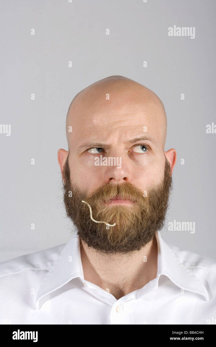 A man with a noodle in his beard Stock Photo Alamy
