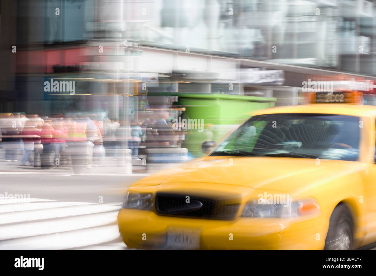 A yellow taxi on a city street, Manhattan, New York City Stock Photo