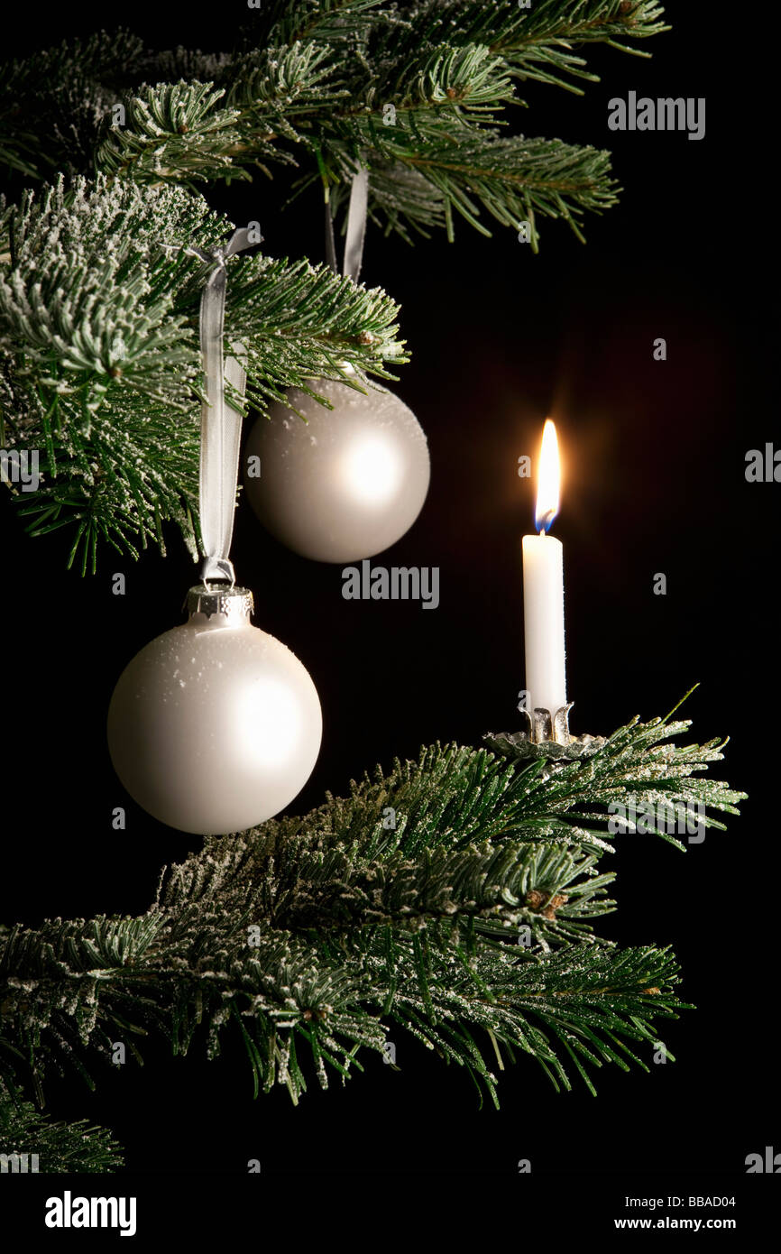 Decoration and a candle on a Christmas Tree Stock Photo