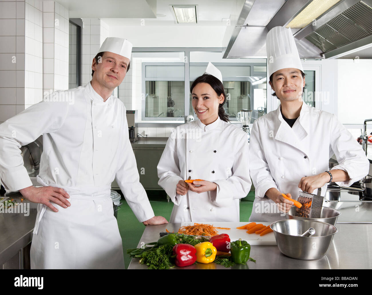 Chefs doing prep work in a commercial kitchen Stock Photo Alamy