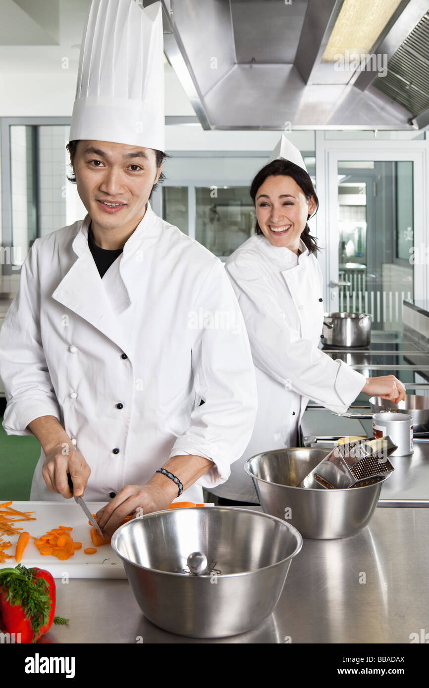 Two chefs having fun while working Stock Photo